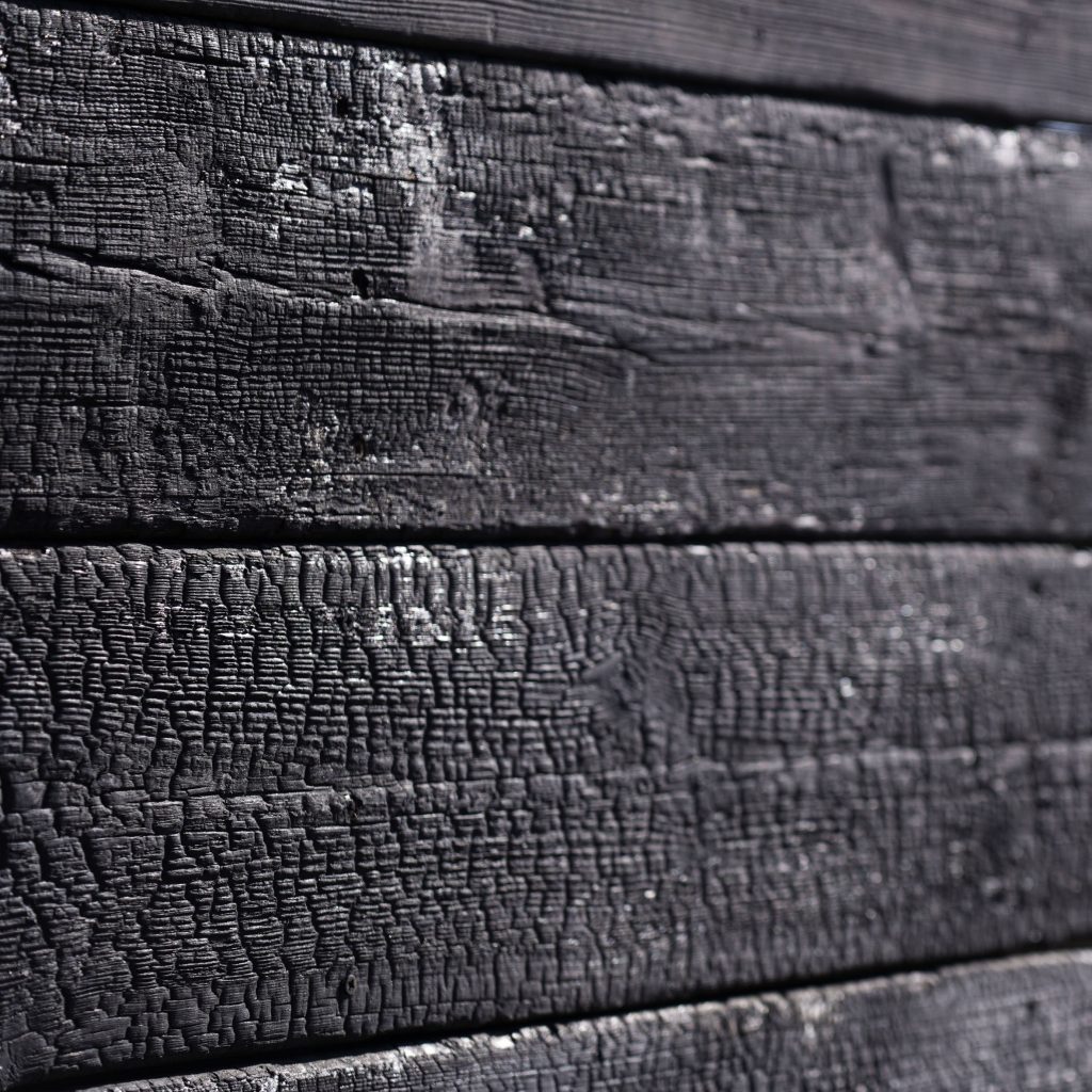 Close-up of the charred external timber boards