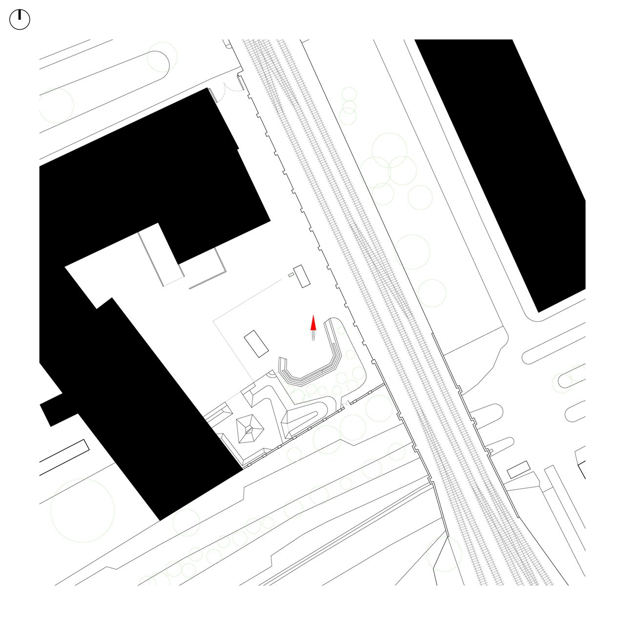Site plan of the La Fabriek courtyard between the railway and the former industrial buildings, with the chapel marked in red