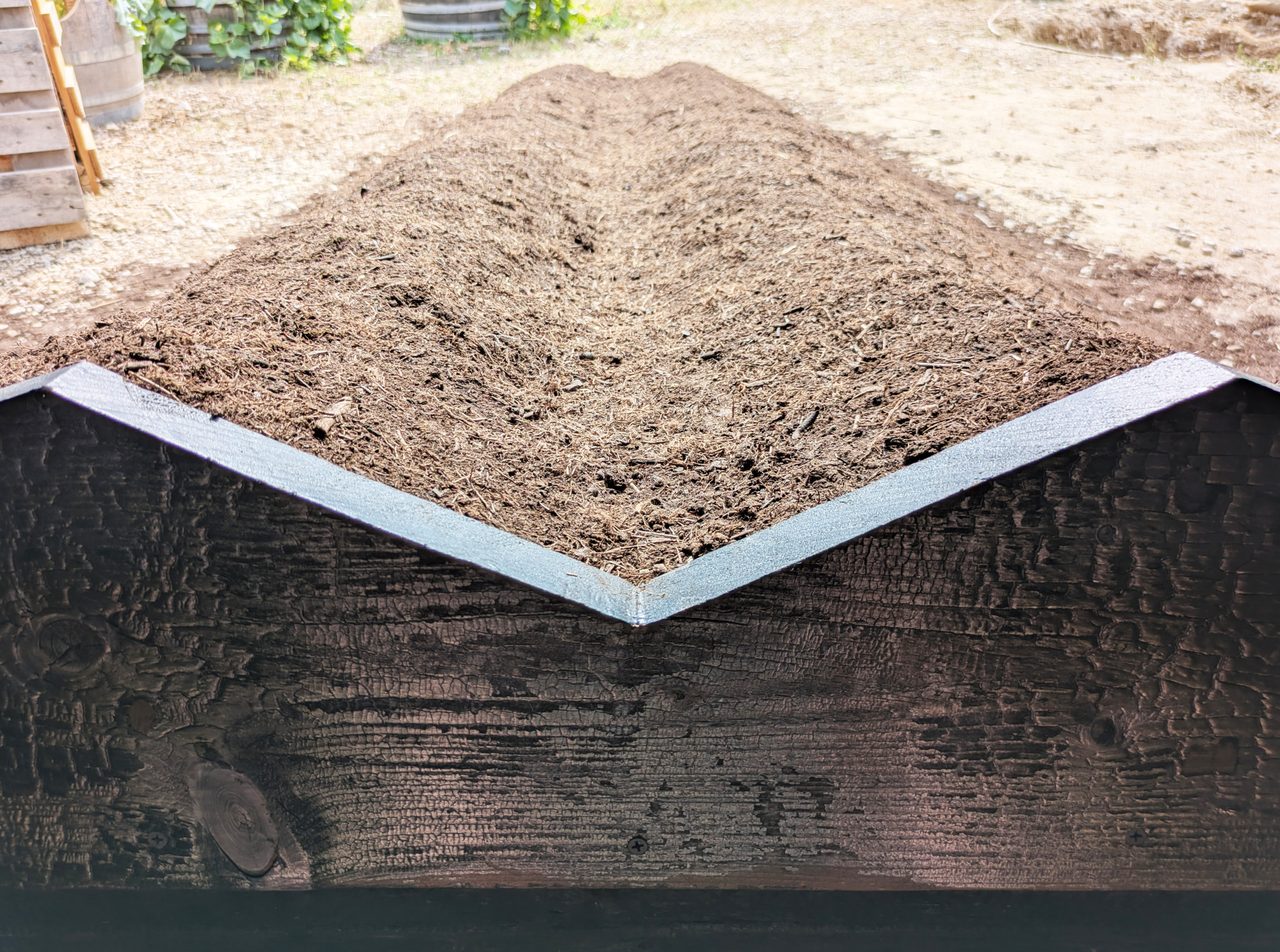 Furrows of earth raised into the chapel interior like an altar