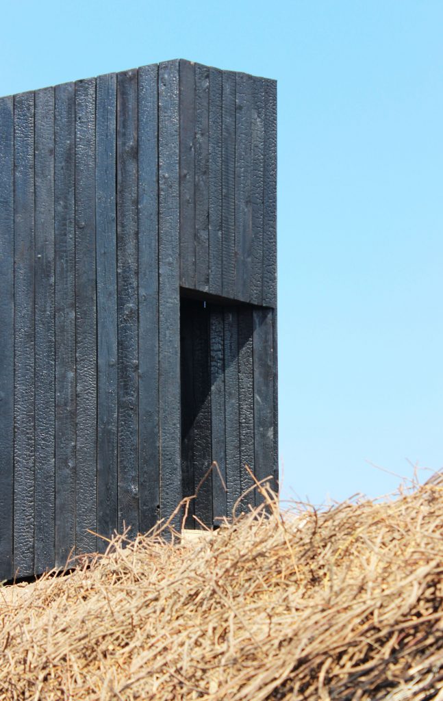 Close approach to the chapel's sloping timber form
